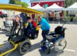 Handicap - Le transfert du fauteuil roulant au OuiCycle se fait facilement